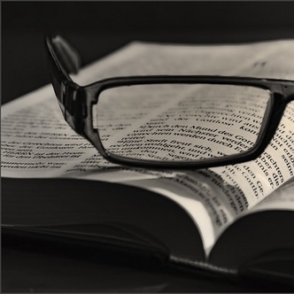 Glasses on Bible